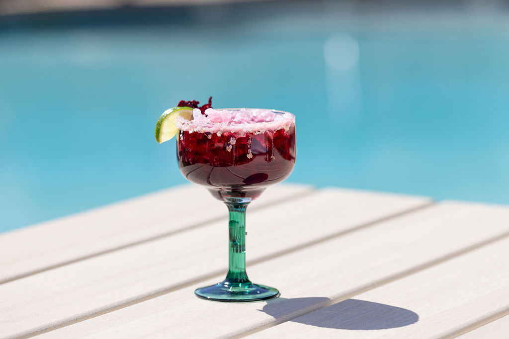 Handcrafted cocktail from The Den enjoyed poolside